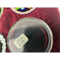 Set of four Caithness paperweights titled Four Seasons, in presentation box with certificate, designed by Colin Terris and made by William Mason, each internally decorated with a seasonal flower within a millefiori cane work garland, numbered 128 of 500