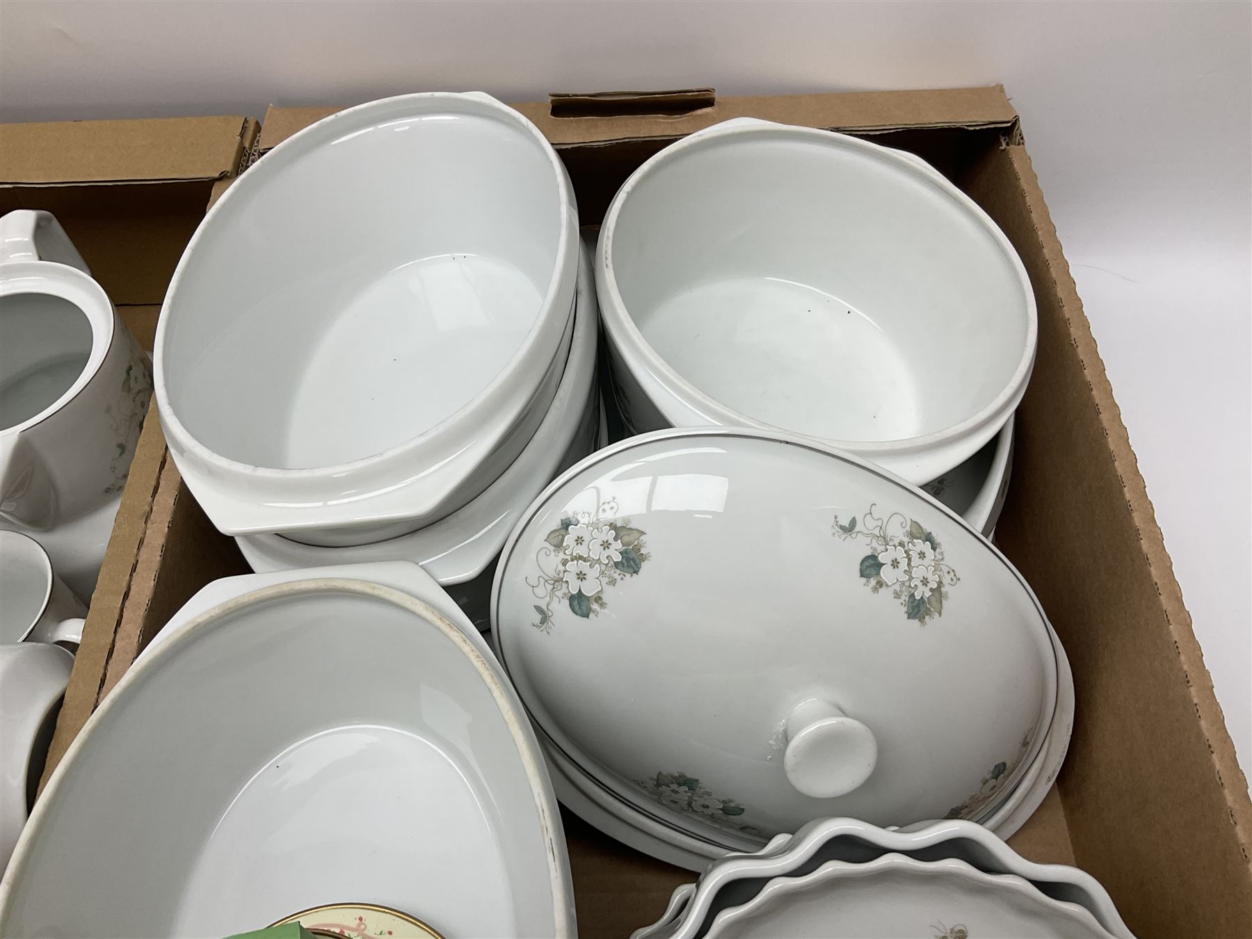 Large quantity of Porcelana Real Brasil White Blossom pattern tea and dinner wares, to include dinner plates, tea cups and saucers, salt and pepper pots, tureens, pie dishes coffee pots, place mats, spoons and glasses, etc, in five boxes 