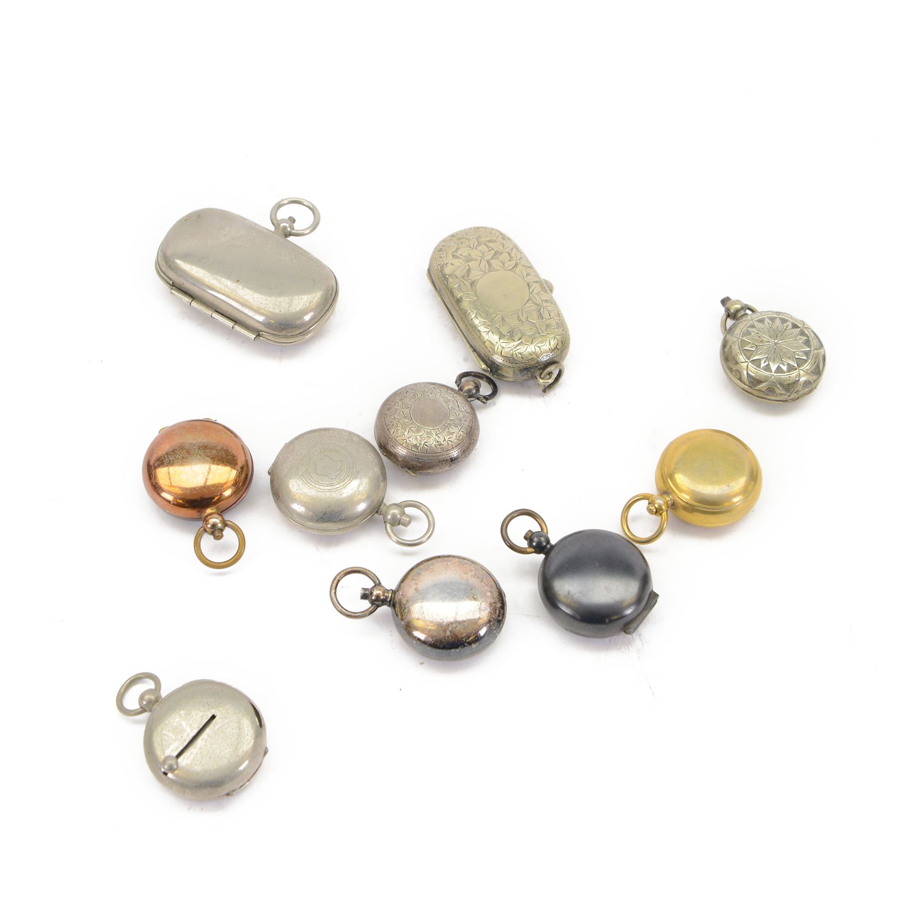 Ten sovereign holders, comprising two oval double sovereign holders and eight single sovereign holders, including brass, silver plate and gunmetal examples