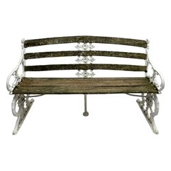 Late 19th century white painted cast iron and wood slatted garden bench, the bench ends in the form of S-scroll mythical beasts with paw feet, central cartouche surrounded by extending trailing foliage, the back slats divided by scroll cast splats, central seat support 