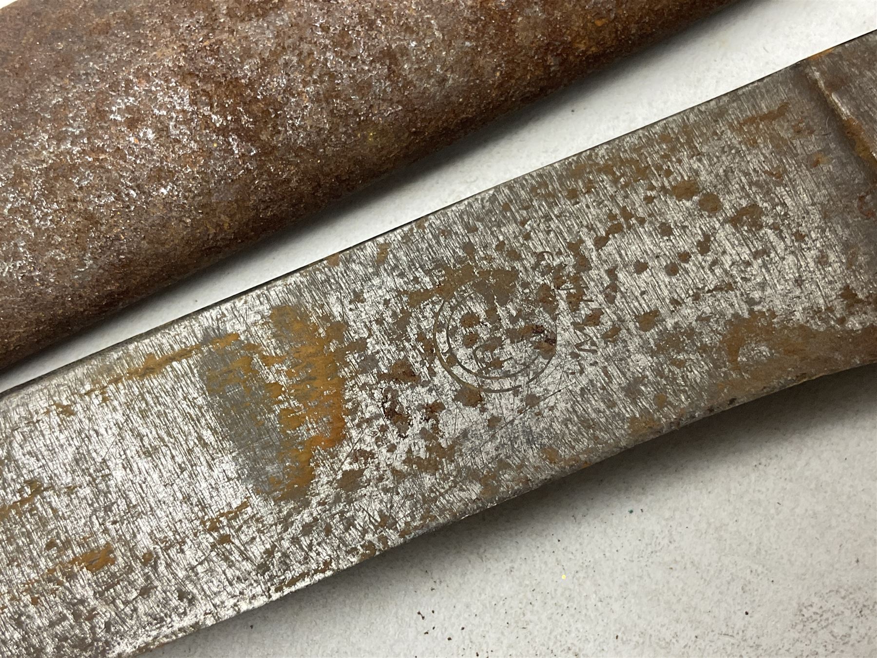 Indian kukri with 29cm curving steel blade and nickel mounted horn grip; in leather covered scabbard with one skinning knife L42cm overall; Hitler Youth knife with scabbard in relic condition; and three African graduated knives each with crudely carved wooden grips and painted leather covered scabbards (5)