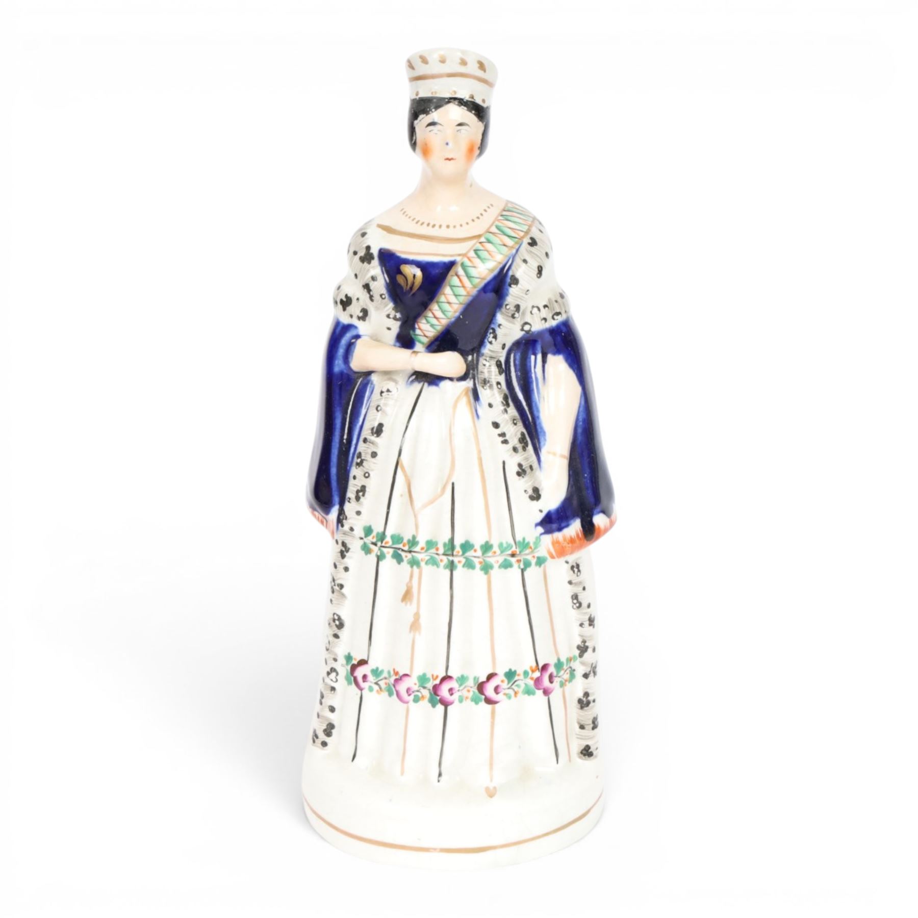 Group of 19th century Staffordshire figures, comprising pair depicting Queen Victorian and Prince Albert, she stood crowned, wearing short cloak, her hand clasped in front of her waist, he wearing cloak and military jacket, tallest example H28cm, figure group depicting The Prince and Princess Alexandra of Denmark, later Princess of Wales, he wearing green jacket and holding top hat in his left hand, she wearing bodice and full length skirt and carrying hat over he right arm, H24.5cm, and figure group depicting Empress Eugenie and Napoleon III, he in uniform, his left hand upon a plinth, she seated in chair, H23.5cm