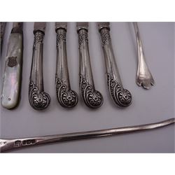 Group of silver, comprising piston grip handled butter knives, 1920s lobster pick, two mother of pearl handled fruit knives, annointing spoon and a teaspoon, all hallmarked 
