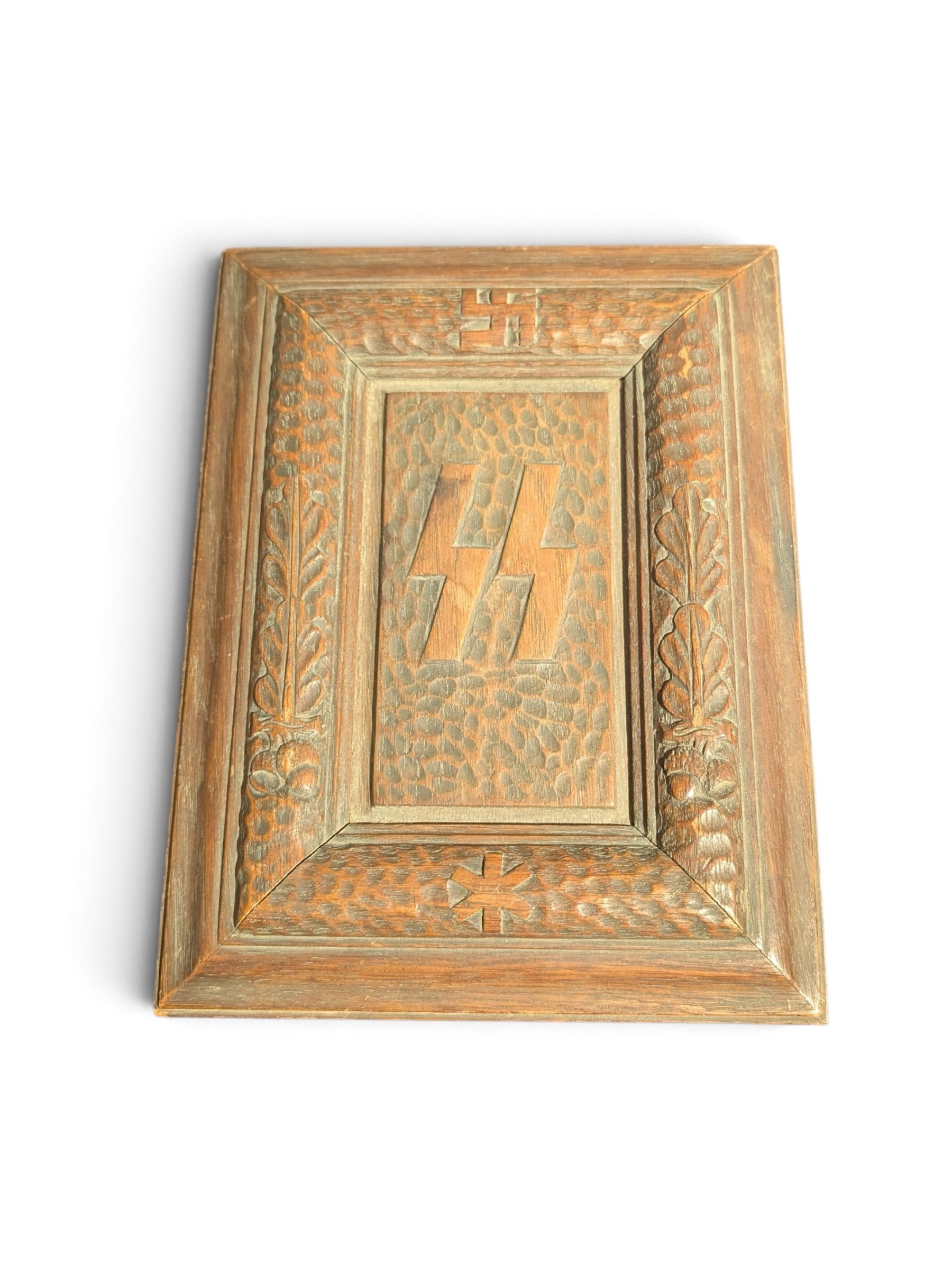 German Third Reich SS oak Mein Kampf presentation box, the lid carved with a raised oakleaf border and recessed centre bearing SS Sigrunen, H7cm