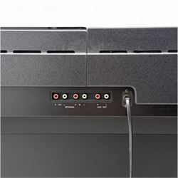 Yamaha Clavinova CLP-550 digital piano, full-size weighted keyboard with integrated pedals and speakers, in dark wood effect casing, accompanied by matching padded bench, Sennheiser headphones, original manuals, and factory-issued cassette tape titled 'Pure & Simple – CLP Digital Pianos'