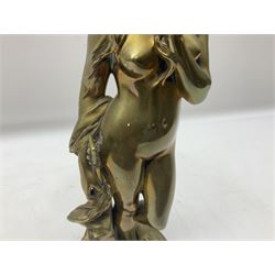 Brass figure of a nude female, standing and holding a guitar on a circular base, H38cm