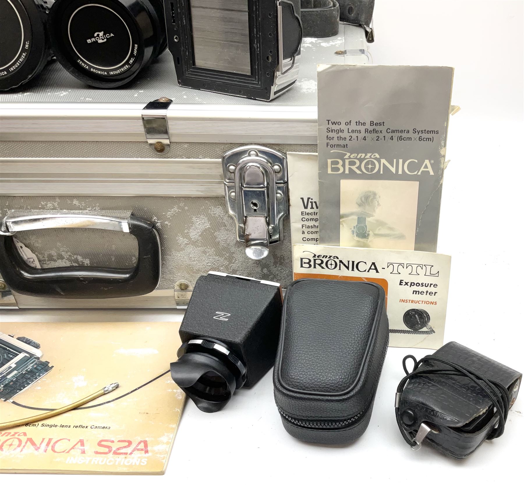 Zenza Bronica S2A medium format camera body, with Zenza Bronica Zenzanon MC '1:2.4 f-80mm' lens, together with Nippon Kogaku Nikkor-P '1:4 f-200mm' lens, Nikkor D.C '1:4 f-40mm' lens, two film backs and other camera equipment, housed in a hard flight case