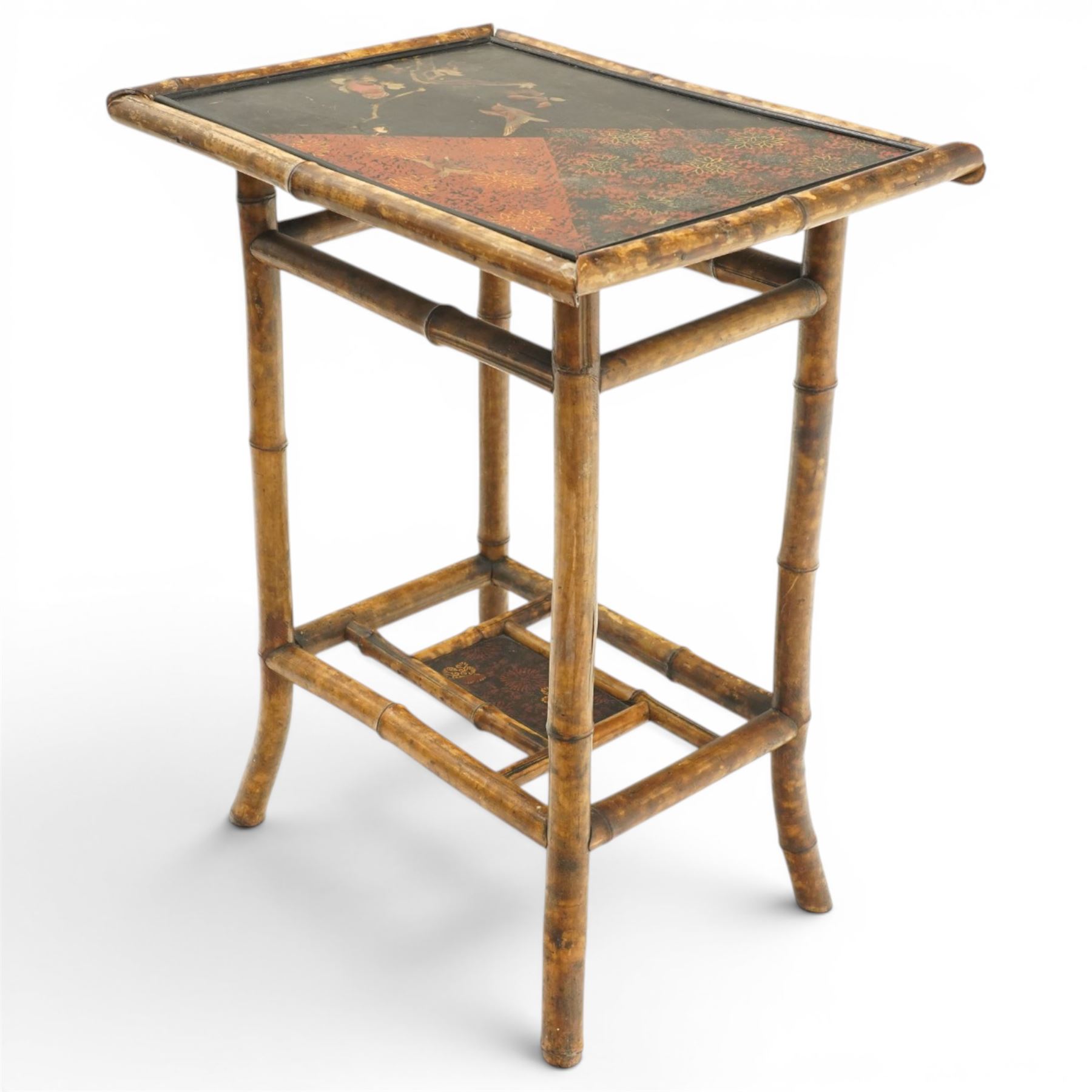 Bamboo and chinoiserie occasional table, rectangular top with geometric print and foliate design, raised on bamboo supports united by an undertier