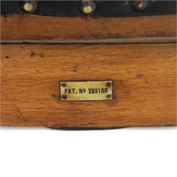 20th century oak recliner armchair, the curved back upholstered in leather with brass stud edging, hinged reclining back operated by side ratchet fittings, leather upholstered seat, shaped open arms, raised on cabriole legs