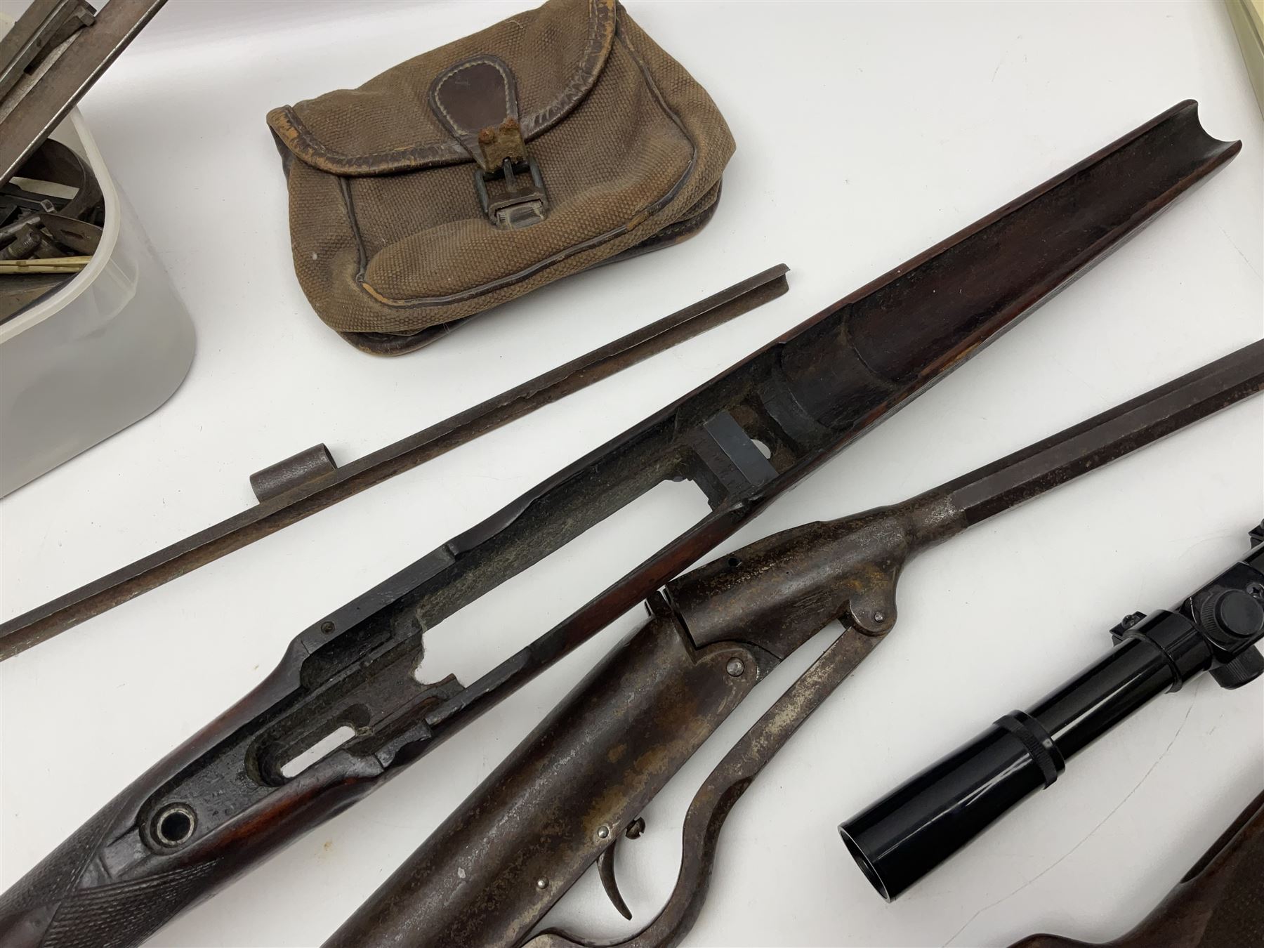 Assorted rifle and pistol spares; early Gem air rifle with sawn off barrel (piece present); telescopic sight; canvas/leather ammunition pouch; Mauser stock; barrel browning solution etc