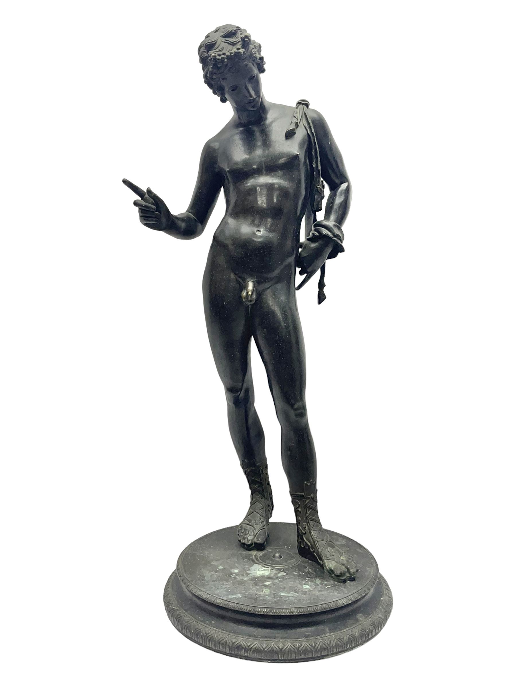 Bronzed classical nude male figure, upon a stepped circular base, H61cm 