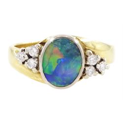 18ct gold opal and diamond ring, single oval cut opal, with three round brilliant cut diam...