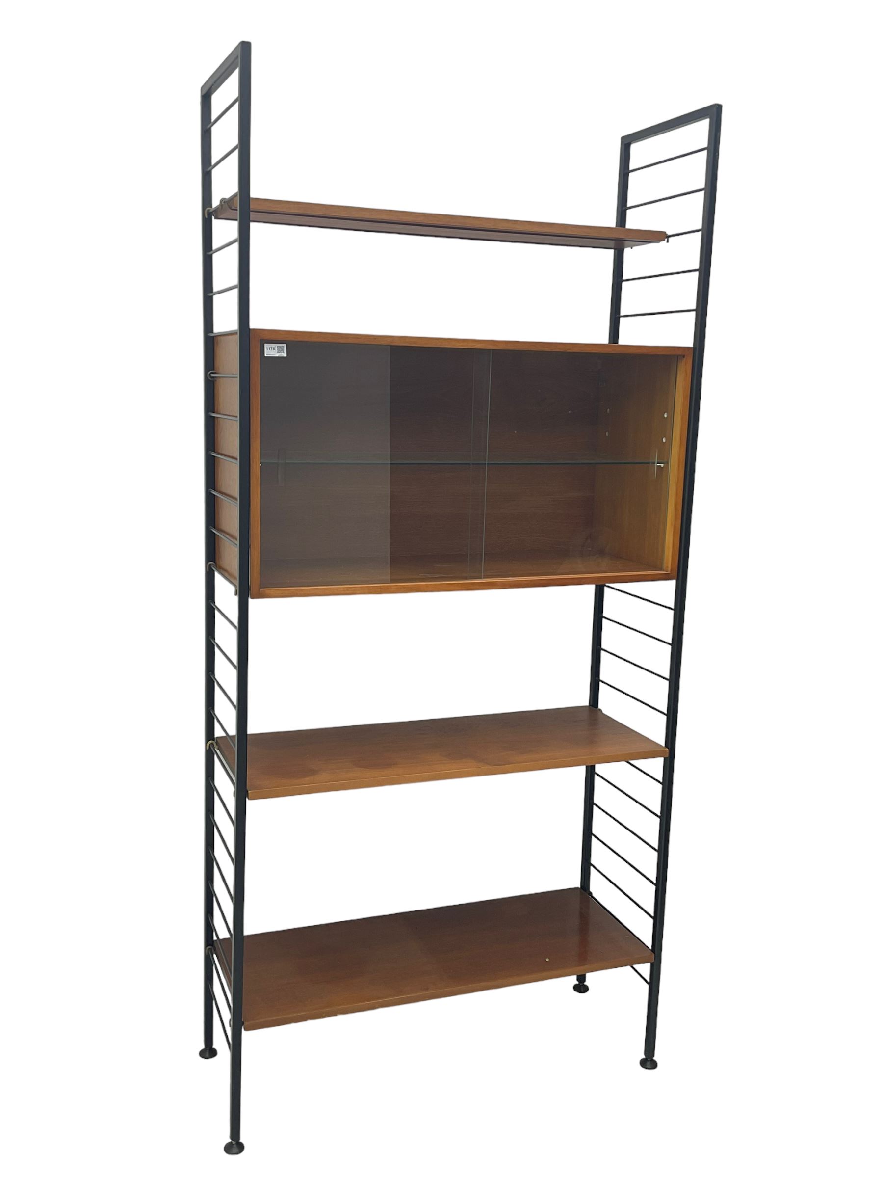 Staples Ladderax - mid-20th century teak and metal framed modular wall unit, fitted with central cupboard, the sliding glazed doors enclosing single shelf, flanked by three adjustable shelves 
