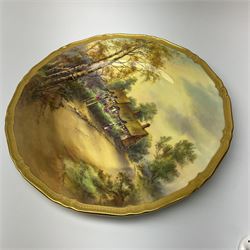 A Royal Worcester cabinet plate, decorated with and titled verso Anne Hathaway's Cottage, signed H Stinton, within a gilt rim, with black printed mark beneath, D27cm