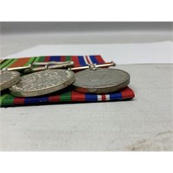 Group of five medals comprising 1939-1945 War Medal, Defence Medal, 1939-1945 Star, Air Crew Europe Star and Canadian Volunteer Service Medal with maple leaf clasp; all with ribbons and mounted on a display board