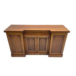 Late Victorian mahogany breakfront sideboard, central frieze drawer over two panelled doors enclosing single shelf, flanked by two single cupboard doors, enclosing shelves and cellarette drawer