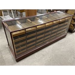 20th century mahogany and glazed haberdashery shop's display cabinet, fitted with thirty-five small drawers, on skirted base  - THIS LOT IS TO BE COLLECTED BY APPOINTMENT FROM THE OLD BUFFER DEPOT, MELBOURNE PLACE, SOWERBY, THIRSK, YO7 1QY