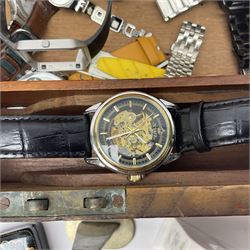 Gold plated Egyptian style ring, two silver wedding bands, and collection of watches including Fitbit and Swatch, housed in a writing slope