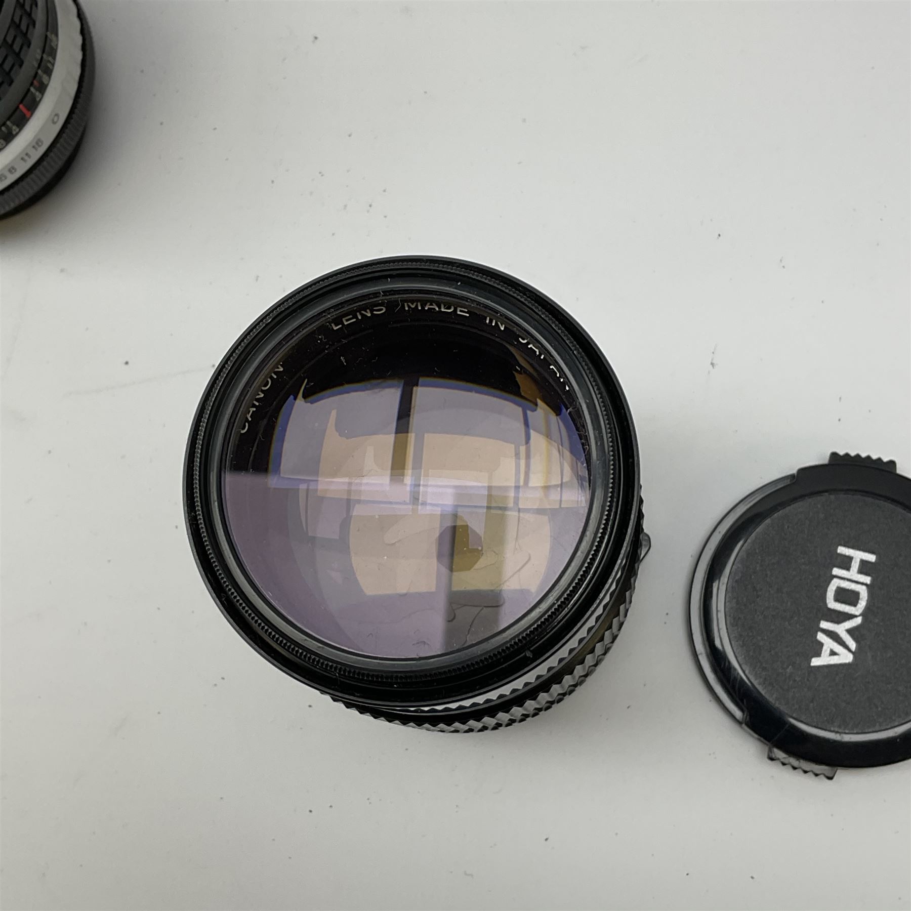 Canon AE1 camera, 'no. 4403757', fitted with Canon 'FD 50mm 1:1.8' lens, Hoya 'HMC Wide-Auto f24mm 1:2.8' lens and various other lenses and camera accessories, housed in a soft carry bag