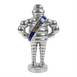 Metal hollow-cast figure, modelled as a Michelin Man stood upon a tire, H26.5cm