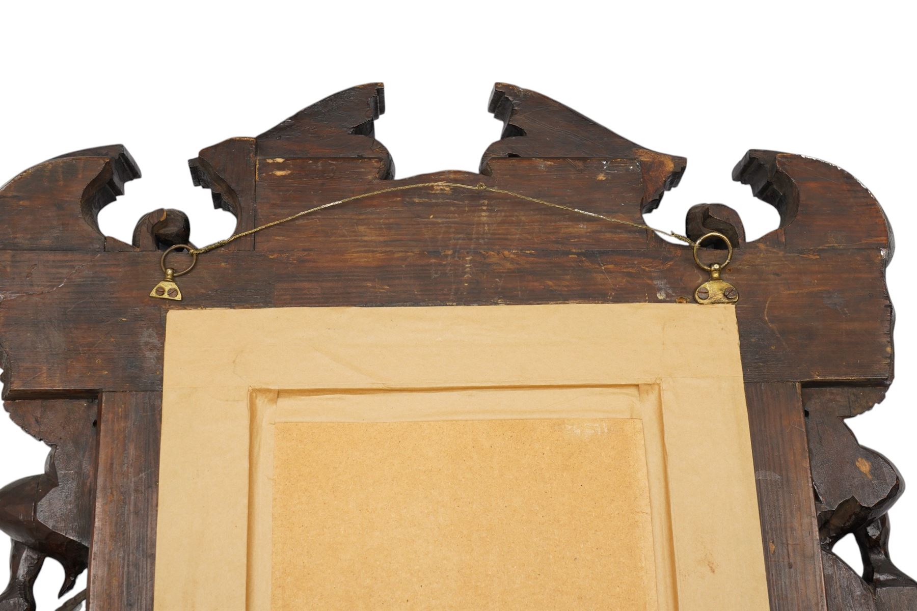 Renaissance-style mid 19th century carved fruitwood wall mirror, carved top surmounted by ‘broken’ arched pediment with central putti figure and grape vine, the sides with two putti figures above C-scroll decorations, and with a similarly carved base