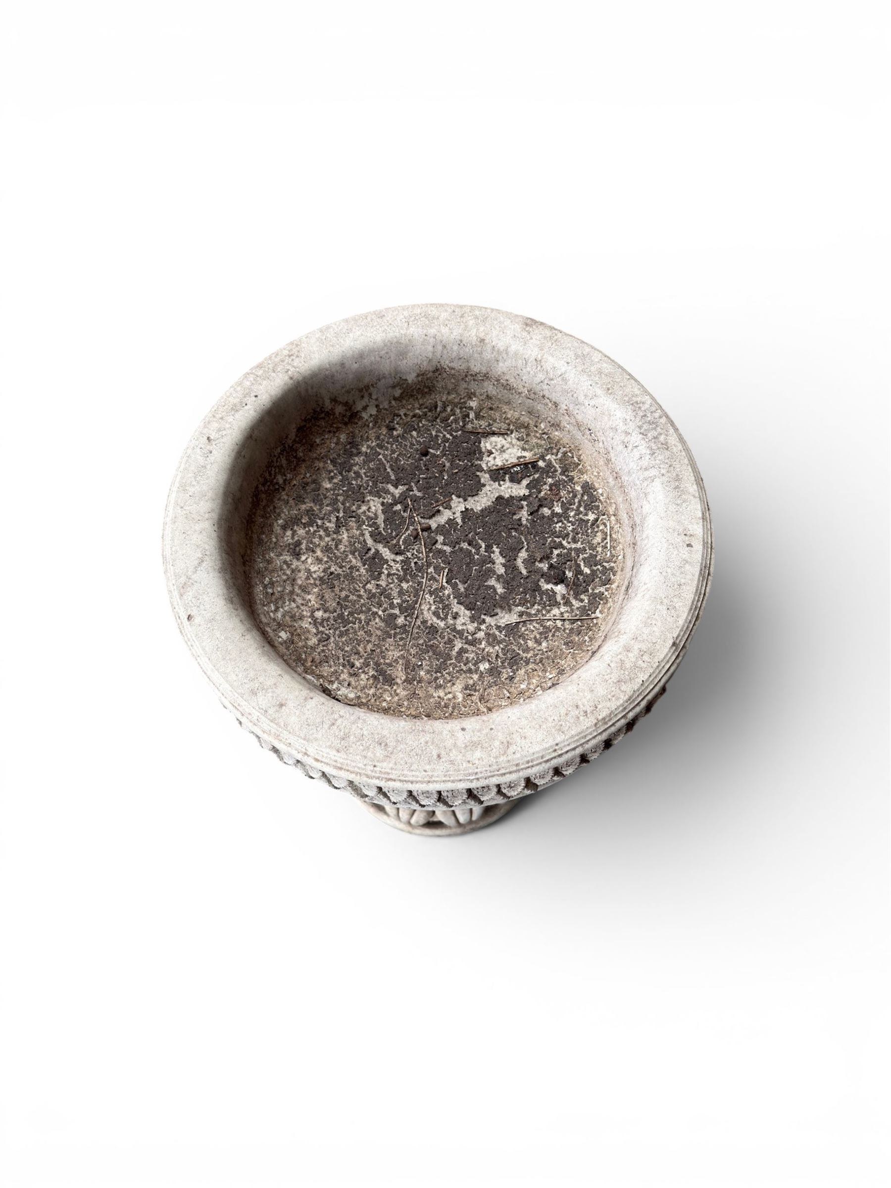 Cast stone cherub bird bath, circular removable top raised on three cherubs with ornate detailing