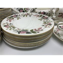 Wedgwood Hathaway Rose pattern tea and dinner wares, comprising twelve saucers, sixteen teacups, twenty tea plates, jug, sucrier, thirteen shallow bowls, sauce boat and saucer, two lidded tureens, larger jug, ten dinner plates, nine smaller plates and two large oval serving dishes