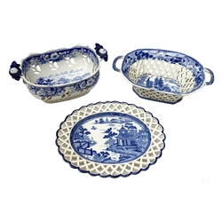 Mid 19th century blue and white transfer printed pearlware reticulated chestnut basket, of oval form with twin handles, decorated to the interior with figures before a classical temple within a garden setting, including handles W26cm, together with a mid 19th century blue and white transfer printed pearlware stand with reticulated edge, decorated with a Willow Pattern, L25cm, and a John and William Ridgeway blue and white transfer printed twin handled pierced basket, decorated with a pastoral scene containing figures at work, with printed mark beneath, including handles L25cm