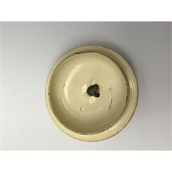 18th century creamware teapot, probably Leeds, with reeded entwined handle and floral finial to the cover, the body with hand painted polychrome decoration of figure to one side, and floral spray to the other, collectors paper label beneath inscribed Leeds Pottery, H11.5cm