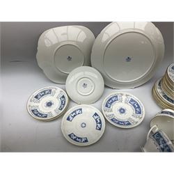 Spode part tea and coffee service decorated in the 'Revelry' pattern, to include five teacups, nine saucers, twelve coffee cans, milk jug and sucrier, coffee pot and tea pot, cake plate etc