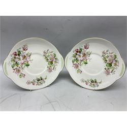 Royal Doulton Apple Blossom pattern tea service for twelve, comprising twelve saucers, twelve tea plates, twelve teacups, milk jug, sucrier and two cake plates