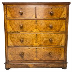 Early 20th century figured walnut chest, fitted with two short over three long drawers with bookmatch veneer facias, each with turned walnut handles, skirted base over compressed bun feet 