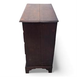 18th century oak chest, the rectangular top above an arrangement of two short over three long drawers fitted with brass batwing handles and escutcheons, raised upon shaped bracket feet