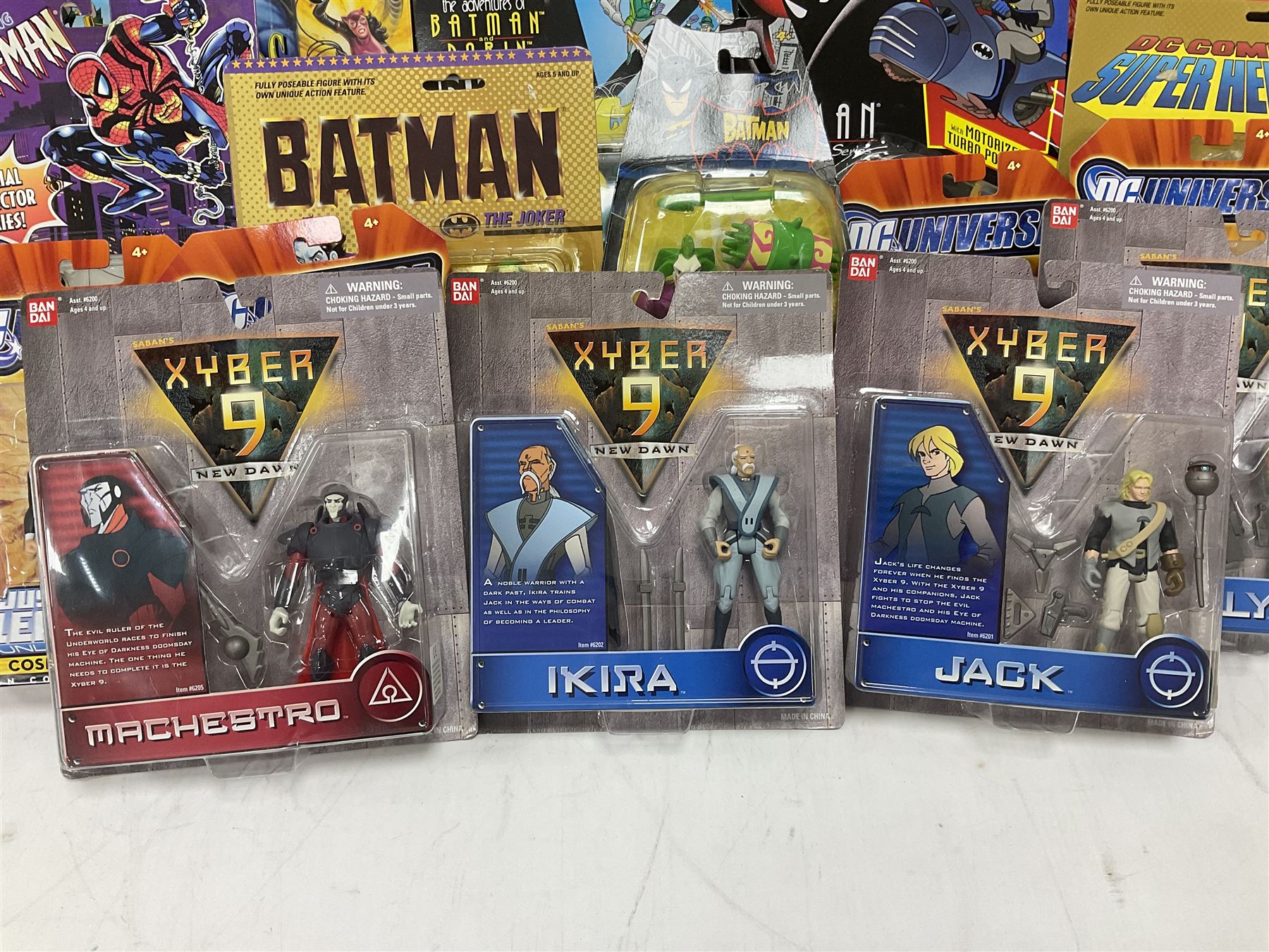 Twenty-four carded action figures of Batman (11) and other Super Heroes including Spiderman, DC Universe, Xyber 9 etc; all in unopened blister packs (24)