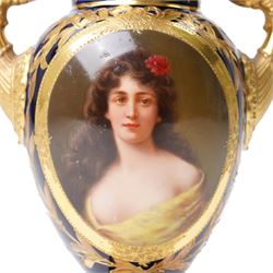 19th century Berlin porcelain urn, with twin gilt volute handles, painted with a portrait bust on cobalt blue ground and decorated profusely in gilt with classical motifs, indistinctly signed, with blue sceptre mark to base, H15cm