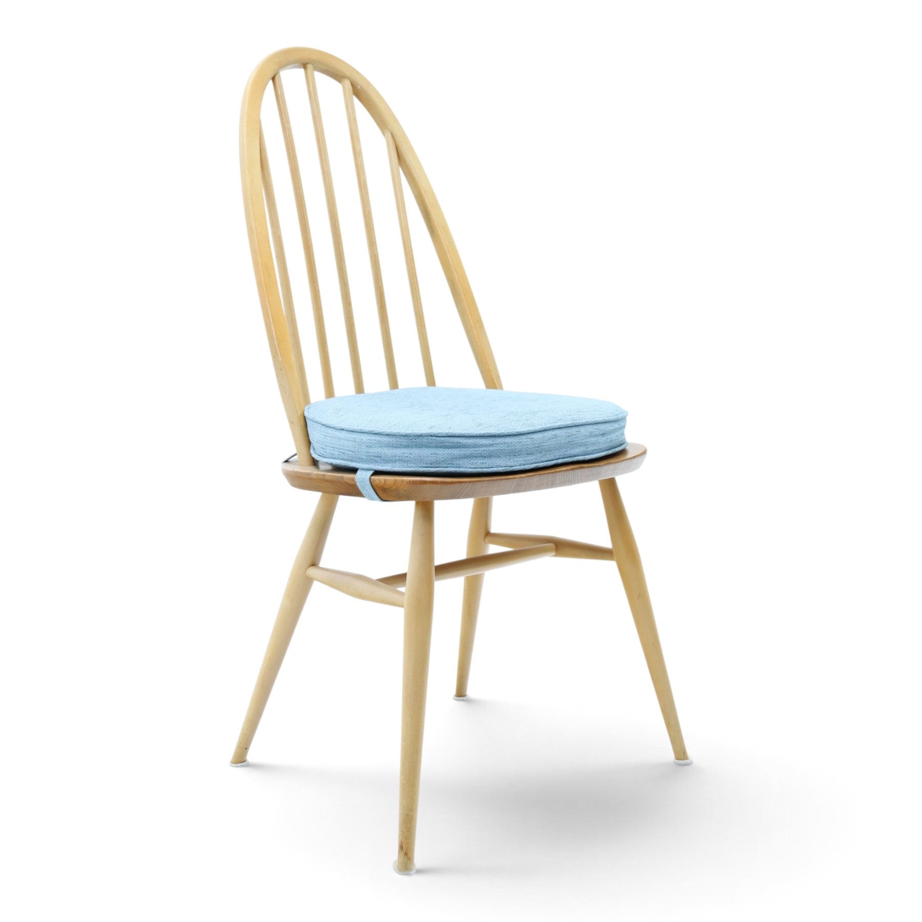 Ercol - set of four 'Quaker' dining chairs, with high hooped back, blue seat cushions with studded, tapered supports  