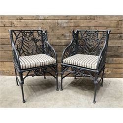Richard Bawden (1936-2024): Pair of Cat design painted cast iron garden armchairs