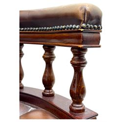 Mahogany framed swivel Captains desk chair, upholstered in brown buttoned leather, turned supports and swivel base on castors