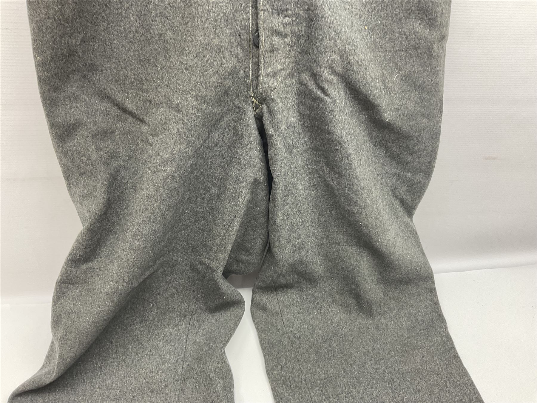 Pair of WW2 German Other Ranks trousers c1940-42, stamped C.& A. Brenninkmeyer Workstatten; WW2 German Army webbing belt with steel 'Gott Mit Uns' buckle; and WW2 German leather belt with 'Stahlhelm' (Steel Helmet League) members buckle (3)