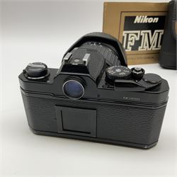 Nikon FM 35mm SLR camera body, Sigma 28-300mm 1:3.5-6.3 lens, Cosina 100mm 1:3.5 macro lens, two macro adaptors, instruction manual, Nikon 'Lite-Touch zoom' 35mm camera, and three relating carrying cases