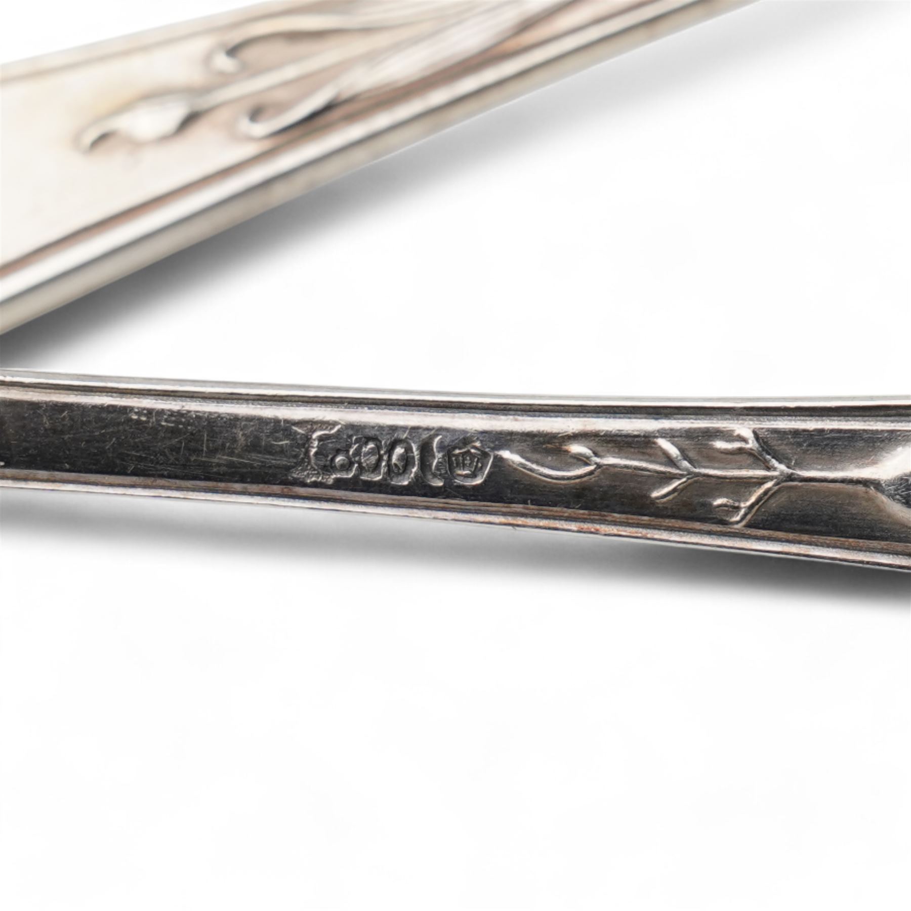 Set of four German 800 standard silver table spoons with floral stems, sifting spoon, unmarked and two teaspoons