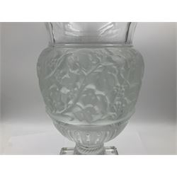 Large and impressive Lalique Versailles pattern glass vase, of classical baluster form with gadrooned flared rim, the body moulded in relief with fruiting vines above part fluting, upon a spreading circular foot with moulded decoration, and plain square plinth base, signed Lalique France to side of plinth, overall H35cm, with original box 