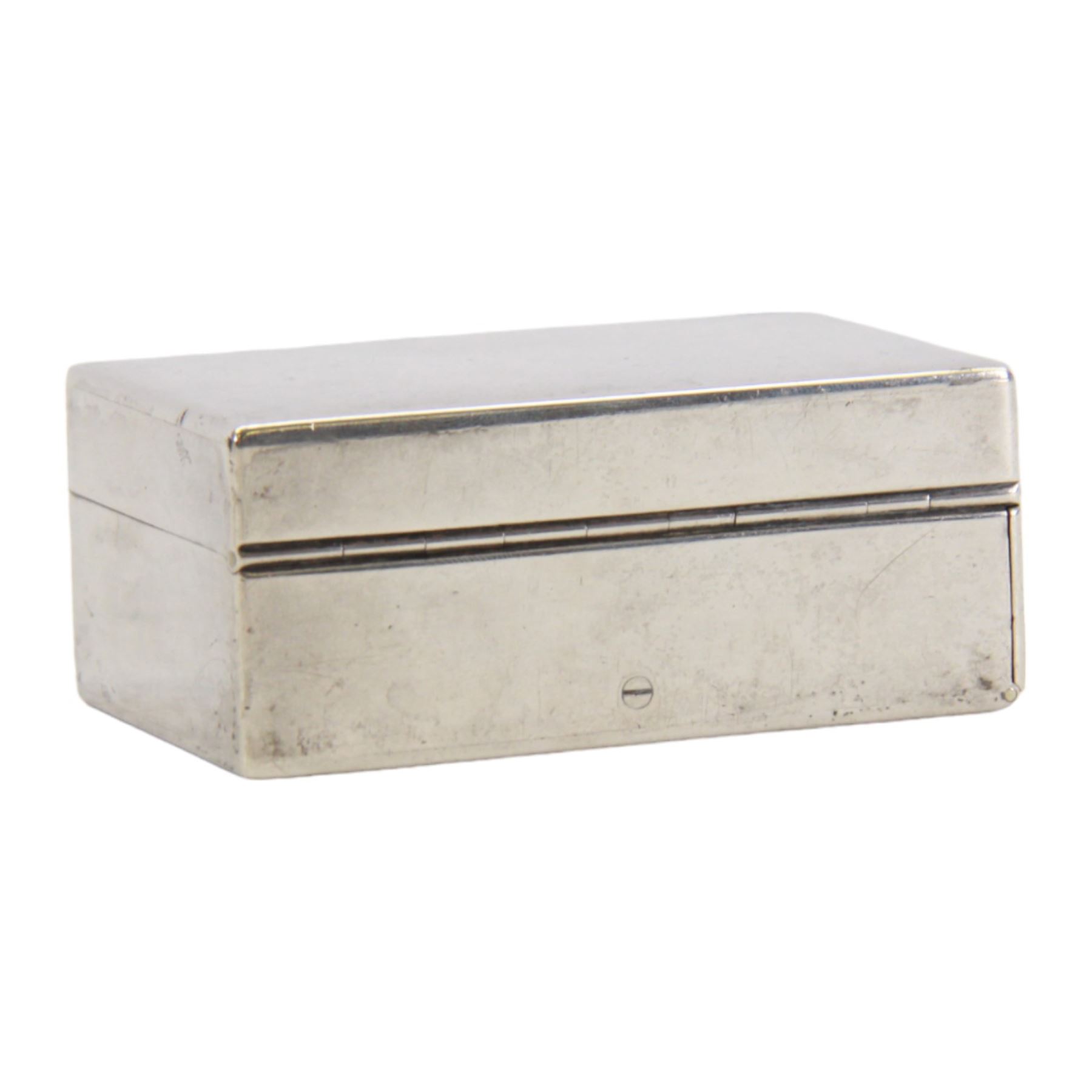 Victorian silver travelling desk compendium, of plain rectangular form, the hinged cover opening to reveal a fitted gilt interior containing inkwell, vesta case, fold down candle holder and seal tray, hallmarked Thomas Johnson I, London 1871, also bearing retailer mark for Asprey Bon Street, H3.5cm W8cm D5.5cm