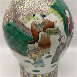 20th century Chinese Famille Rose vase, of baluster form with flared lobed rim and twin figural handles, decorated in polychrome enamel with figures dancing and playing instruments within a garden setting, H42cm
