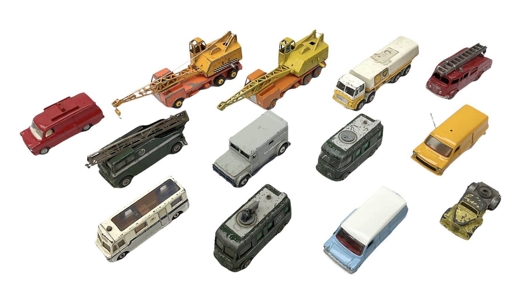 Dinky - thirteen unboxed and playworn die-cast commercial vehicles including two Supertoys 20-Ton Lorry-Mounted Cranes; Leyland Octopus Tanker; Fire Engine No.955; Extending Mast Vehicle No.969; two TV Roving Eye Vans No.968; three Ford Transit Vans; Brinks Armoured Car No.275; etc