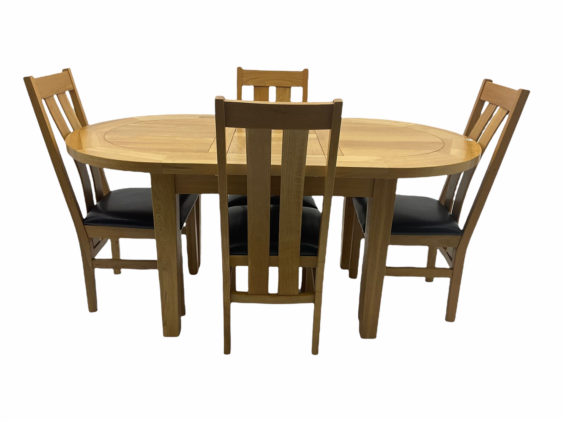 Solid oak oval extending dining table, butterfly leaf extension, four chairs with brown upholstered seats