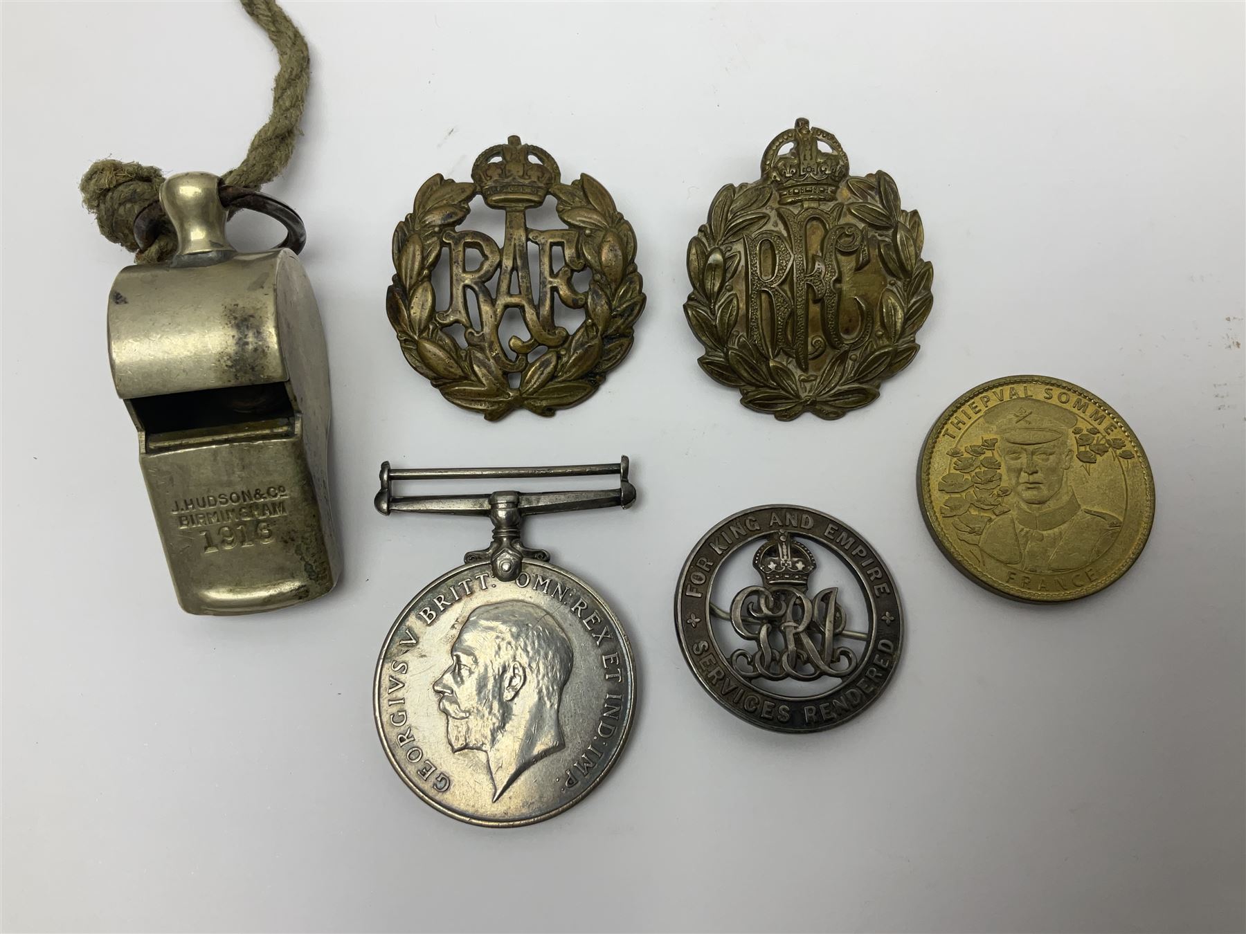 WWI J. Hudson & Co. Birmingham trench whistle dated 1916; WWI British War Medal awarded to 117363 Gnr. N.L. Wright R.A.; Services Rendered badge No.111643; RAF & RFC cap badges etc