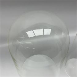 Tabletop glass display cabinet, with hinged door, together with two glass domes