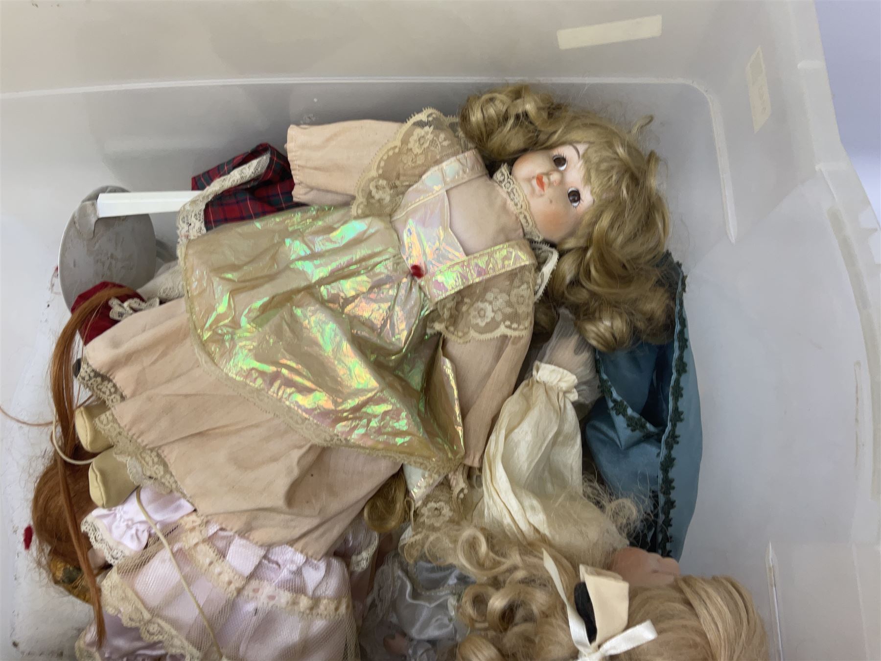 Vintage Paddington bear, with red duffle coat and hat and green Wellington boots, together with a collection of porcelain dolls, paddington H48cm 