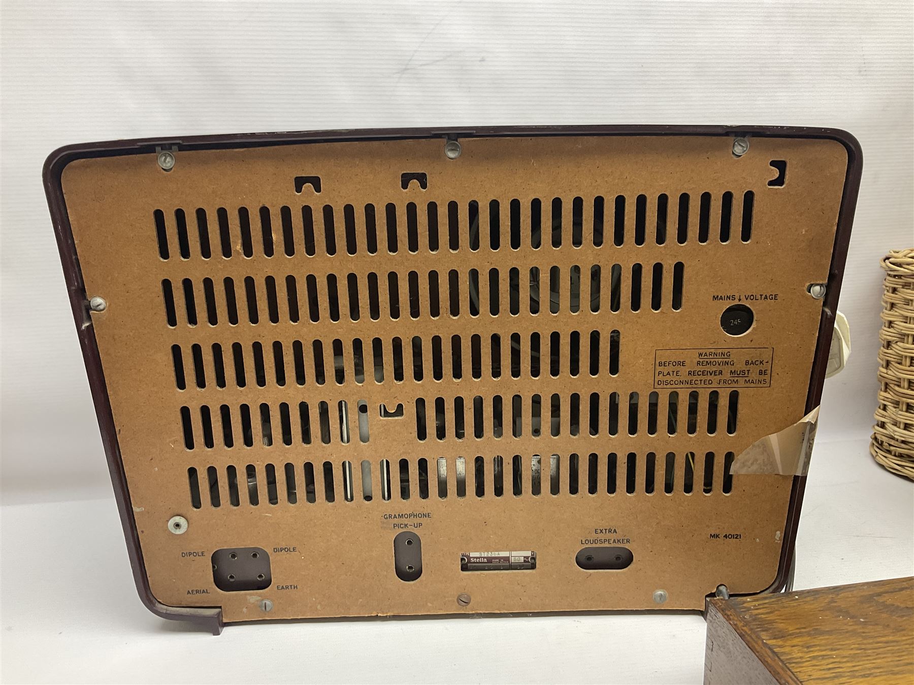 Early 20th century burr walnut tea caddy, Art Deco wooden box, wicker basket with bottle holders and a 1950s Stella radiogram